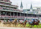 La Cara (7) leads Tenma (9) around the first turn in the 151st Kentucky Oaks at Churchill Downs. Eventual winner, Good Cheer (11), is towards the back in the blue cap, silks, and white and blue blinkers.