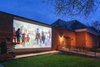 International known artist Celeste Suzany works on a mural of historic horses over a two month period on the west side of the National Museum of Racing and Hall of Fame in Saratoga Springs, N.Y. Skip Dickstein/ for the Times Union
