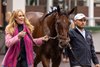 Anna's Co-Owner and breeder, Judy Hicks, and a groom for Kenny McPeek walk Thorpedo Anna in the paddock at Churchill Downs.