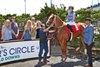 Jockey Talliyah Timentwa, aboard Made to Impact, celebrates her first Emerald Downs victory