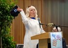 Dottie Shirreffs throws her late husband John Shirreffs’ hat in to the crowd during the acceptance of the induction at the 2026 Hall of Fame Induction Ceremony held at the Fasig Tipton Sales Pavilion Friday Aug.7, 2026 in Saratoga Springs, N.Y. The throwing of the hat mimics what her husband did when his trainee Zenyata won the Breeders’ Cup Classic in 2009. Photo by Skip Dickstein
