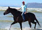 Ebony Flyer and trainer Justin Snaith at the beach in Cape Town.