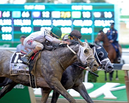 Creator (white blinkers) wins a photo finish against Destin in the 2016 Belmont Stakes