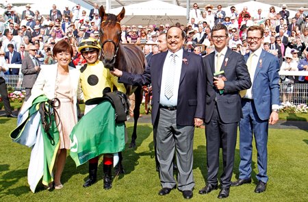 Andrea Atzeni (second from left) and Sheikh Mohammed Obaid Al Maktoum (third from right) in the winner's enclosure after Postponed's victory in the 2016 Juddmonte International Stakes at York