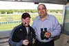 Former Monmouth Park Announcer and current NBC Triple Crown and Breeders&#39; Cup Announcer Larry Collmus (L) joins current Monmouth Park Announcer Frank Mirahmadi in the booth to call the 6th race at Monmouth Park in Oceanport, New Jersey on Sunday May 21, 2017. 