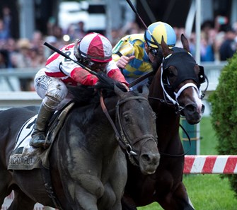 Cloud Computing with jockey Javier Castellano, left catches Classic Empire with jockey Julien Leparoux at the wire to win the 142nd running of the Preakness Stakes Saturday May 20, 2017 at Pimlico Race Course in Baltimore, MD.  