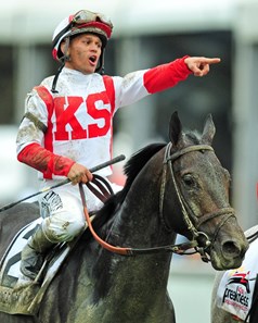 Javier Castellano on his way to the winners' circle, after winning the 142nd Preakness Stakes on Cloud Computing.
