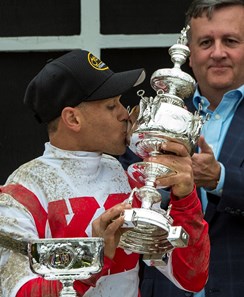 Cloud Computing's jockey kisses the winner's trophy aloft after winning the 142nd running of the Preakness Stakes Saturday May 20, 2017 at Pimlico Race Course in Baltimore, MD.  