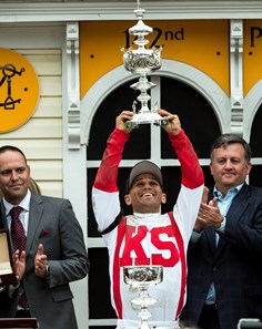 Cloud Computing's jockey holds the winner's trophy aloft after winning the 142nd running of the Preakness Stakes Saturday May 20, 2017 at Pimlico Race Course in Baltimore, MD.  