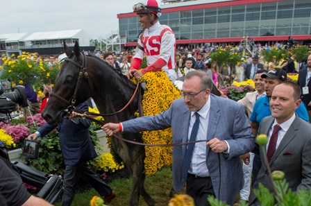 Cloud Computing with jockey Javier Castellano enters the winner's circle with owner Seth Karman, center and trainer Chad Brown right after winning the 142nd running of the Preakness Stakes Saturday May 20, 2017 at Pimlico Race Course in Baltimore, MD.