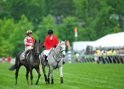 Cloud Computing and Javier Castellano on their way to the winners' circle, after winning the 142nd Preakness Stakes