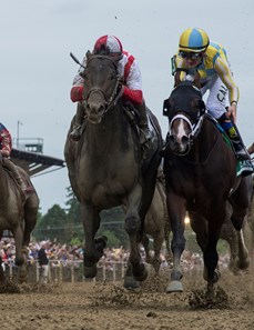 Cloud Computing with jockey Javier Castellano, left catches Classic Empire with jockey Julien Leparoux at the wire to win the 142nd running of the Preakness Stakes Saturday May 20, 2017 at Pimlico Race Course in Baltimore, MD.  Photo by 