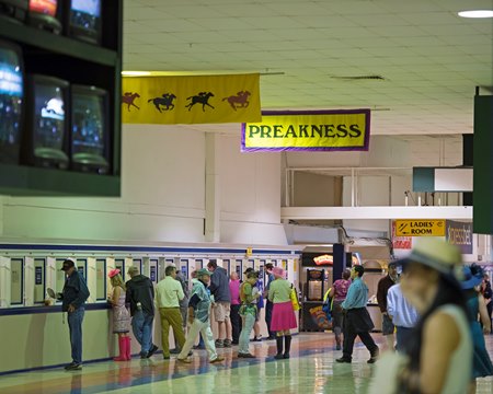 Fans bet on the Preakness Stakes at Pimlico Race Course