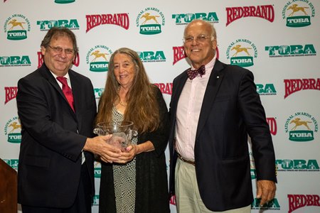 (L-R): Dan Rosenberg presents the Robert N. Clay Award to Susie and Wayne Chatfield-Taylor at the 2019 TOBA National Awards Dinner