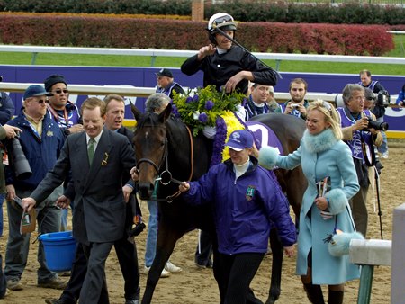 Frankie Dettori tosses his riding crop after guiding Ouija Board to victory in the 2006 Breeders' Cup Filly & Mare Turf at Churchill Downs