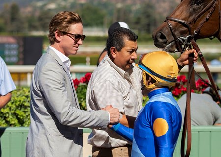 (L-R): Dan Blacker congratulates jockey Victor Espinoza after Hit the Road's win in the 2019 Zuma Beach Stakes at Santa Anita Park