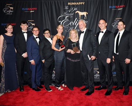 Larry and Nanci Roth and daughter Jaime Roth (C) with Alex Solis, third from left, Jason Litt, second from right, and Brad Cox (R), at the 2019 Eclipse Awards