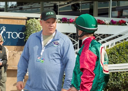 Trainer Mike Puype speaks with jockey Flavien Prat