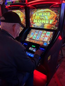 A patron plays a historical horse racing device at Derby City Gaming in Louisville, Ky.