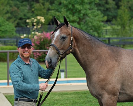 Randy Gullatt with the Mission Impazible yearling out of Tizfiz at Twin Creeks Farm