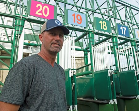 Starter Scott Jordan in 2020 next to the Kentucky Derby starting gate at Churchill Downs