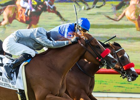 Bodhicitta (outside) en route to victory in the Yellow Ribbon Handicap at Del Mar