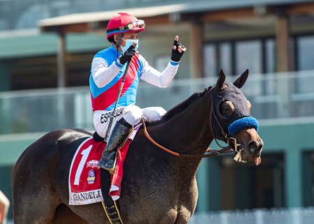 Victor Espinoza celebrates aboard Princess Noor after her victory in the Chandelier Stakes at Santa Anita Park