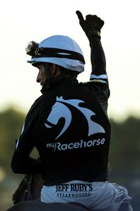 John Velazquez, wearing the colors of co-owner MyRacehorse, celebrates a victory from Authentic in the 2020 Kentucky Derby at Churchill Downs