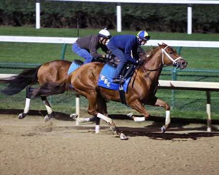 Monomoy Girl (outside) moves past graded stakes winner Owendale in an Oct. 24 breeze at Churchill Downs