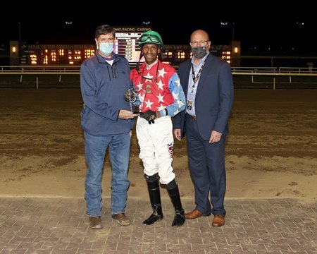 DeShawn Parker receives a trophy for winning the jockey title for the 2020 Indiana Grand meet
