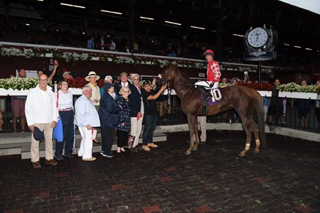 Ellen Bongard (fifth from left with blue jacket) and her partners celebrate Fancycase's win at Saratoga Racecourse in 2018
