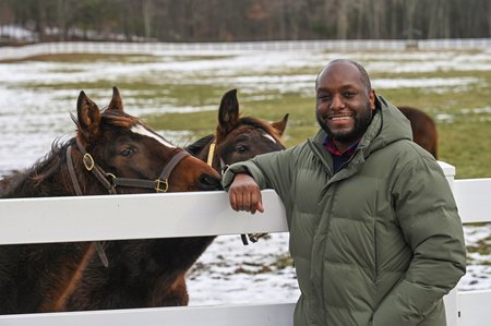 Najja Thompson alongside yearlings in 2021 at Song Hill Farm in New York