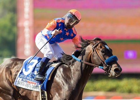 Umberto Rispoli celebrates winning the Santa Anita Derby aboard Rock Your World at Santa Anita Park