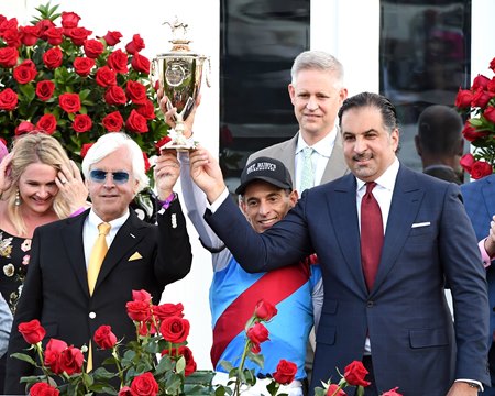 (L-R): Trainer Bob Baffert, jockey John Velazquez, and owner Amr Zedan hold the Kentucky Derby trophy after Medina Spirit crossed the wire first in the 2021 race at Churchill Downs