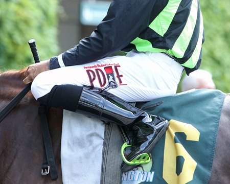 A rider wears the PDJF logo