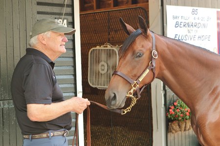 Richard Kent and the Bernardini filly consigned as Hip 85 at The Saratoga Sale