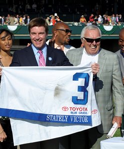 Tom Conway (R) and his son Jack (L) in the winner's circle at Keeneland after Stately Victor's win in the 2010 Blue Grass Stakes at Keeneland