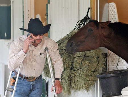 Chip Woolley alongside 2009 Kentucky Derby winner Mine That Bird