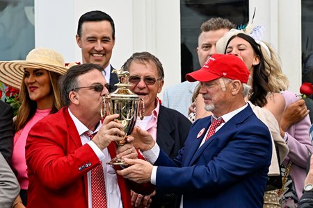(L-R): Trainer Eric Reed and owner Rick Dawson hold the Kentucky Derby trophy after Rich Strike's victory in the 2022 classic at Churchill Downs