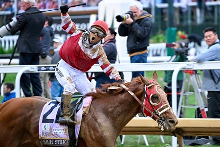Jockey Sonny Leon celebrates an upset from Rich Strike in the Kentucky Derby at Churchill Downs