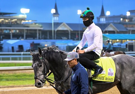 Trainer John Ortiz accompanies Barber Road to the track for training ahead of the Kentucky Derby at Churchill Downs