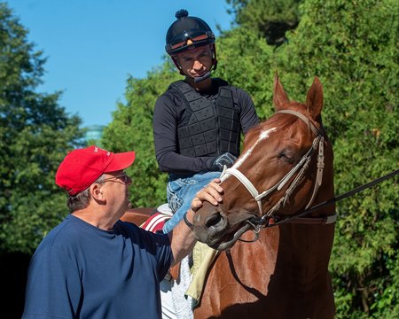 Trainer Eric Reed and exercise rider Gabriel Lagunes with Rich Strike at Belmont Park