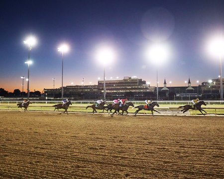 Racing during twilight hours at Churchill Downs