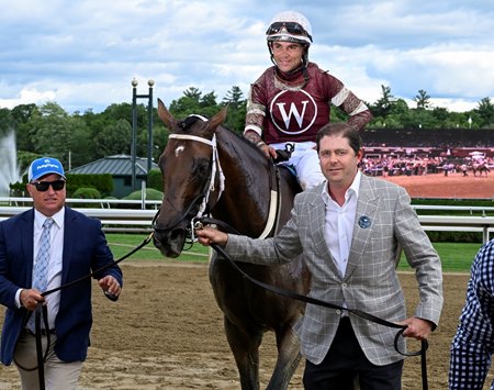 Owner Ron Winchell walks in Epicenter after winning the Jim Dandy Stakes at Saratoga Race Course