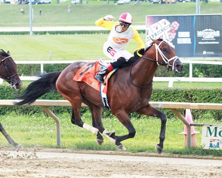 Edwin Gonzalez celebrates a victory from Skippylongstocking in the West Virginia Derby at Mountaineer Racetrack & Casino