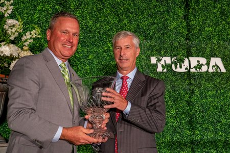 TOBA president Dan Metzger presents the National Owner of the Year Award to Michael Banahan of Godolphin during the 2021 TOBA Awards Dinner