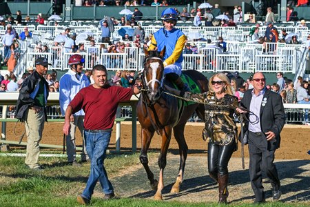 Owner Susan Naylor (second from right) leads her homebred Andthewinneris to the winner's circle after the 2022 Bourbon Stakes at Keeneland