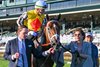 (L-R) Perry Bass and Ramona Bass lead in Annapolis with Irad Ortiz, Jr. after winning Coolmore Turf Mile (G1) at Keeneland, Lexington, Kentucky on October 8, 2022