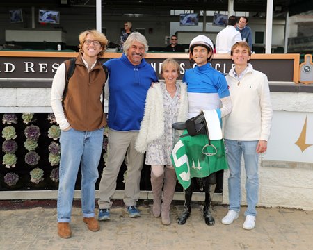 The Asmussen family celebrates a victory from Keith Asmussen (second from right) at Churchill Downs