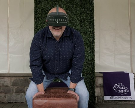 BloodHorse's Joe Perez reacts to the JockeyCam VR Experience at Keeneland